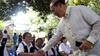 20. Cong. Leopoldo Bataoil shakes hand of a member of the Phil. Retirees Association.jpg