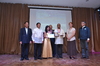Mr. Carlo Amores and Ms. Coleen Joyce Amores receive the award for Capt. Carlos Amores.JPG
